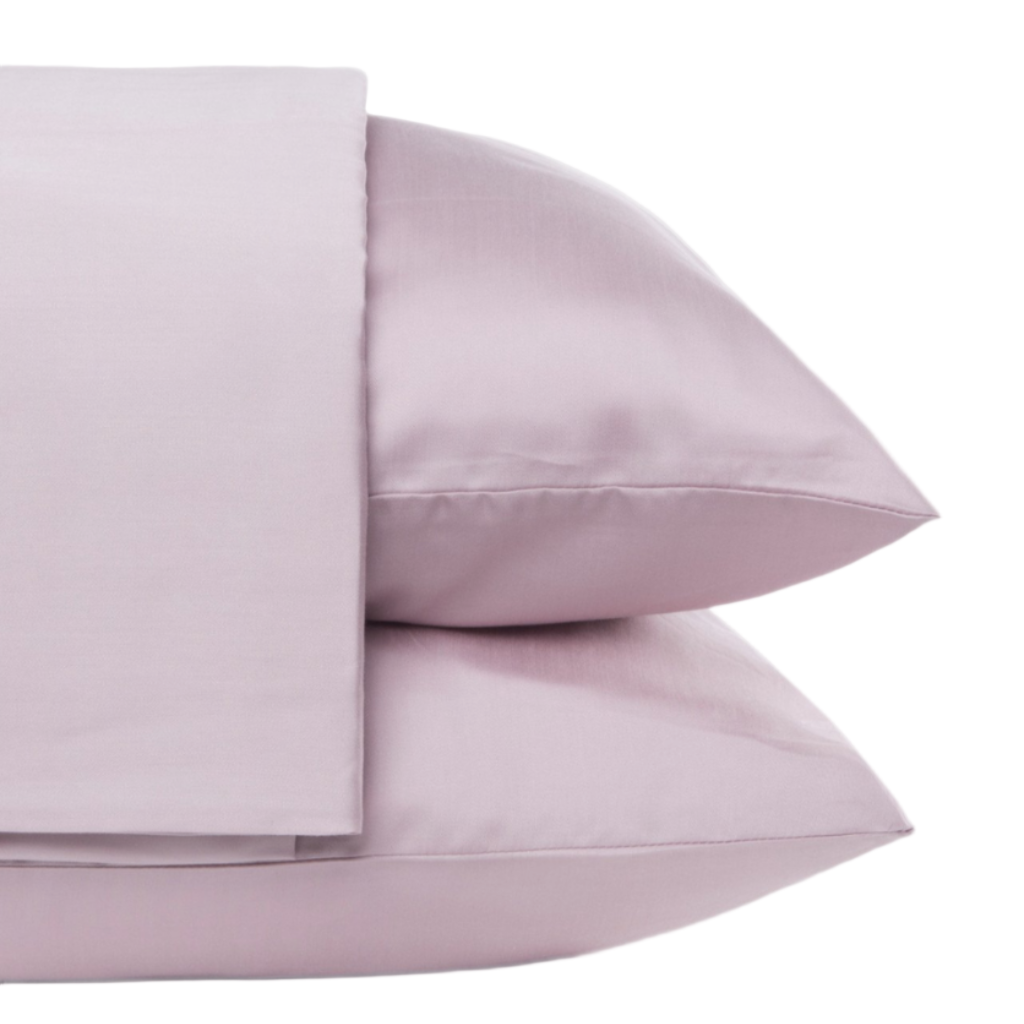 A set of pink Tencel duvet cover and two shams, neatly displayed.